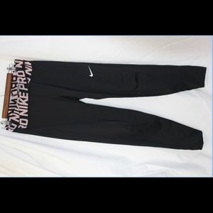Black Nike pro leggings with crossed waistband